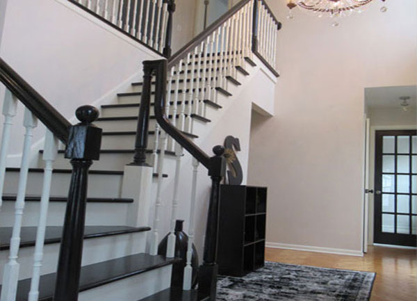 White and black home's custom staircase design